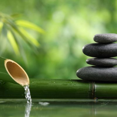 Spa still life with bamboo fountain and zen stone